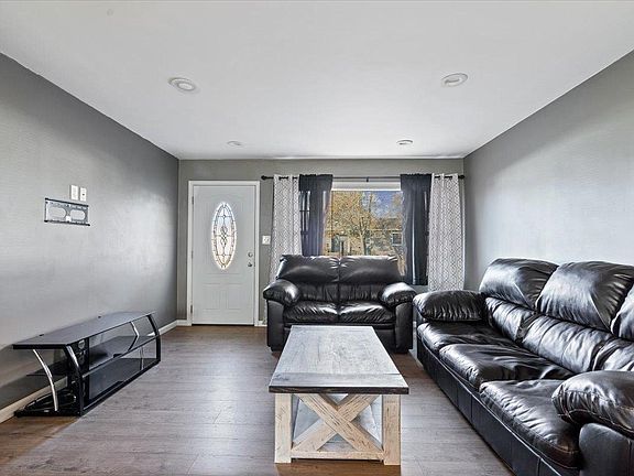 A living room filled with furniture and a coffee table.