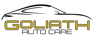 A logo for goliath auto care with a car on it