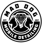 A black and white logo for mad dog mobile detailing with two dogs and a diamond.