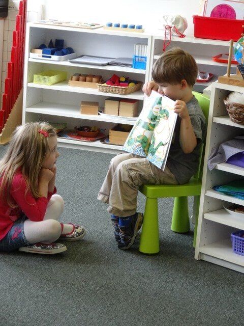Boy showing something to his friend - Montessori school in North Bend, WA