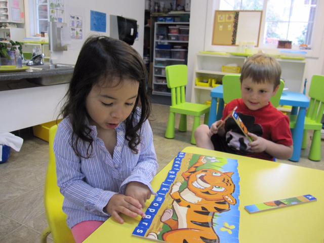 Boy and girl playing letters - Montessori school in North Bend, WA