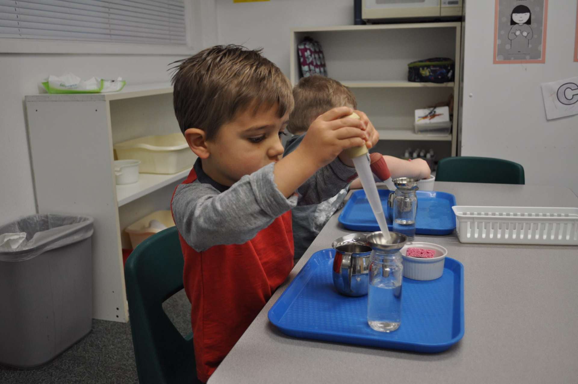 Child performing experiment - Preschool and Kindergarten in North Bend, WA