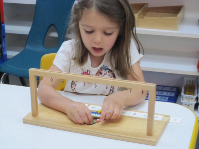 Girl playing toys13 - Montessori school in North Bend, WA