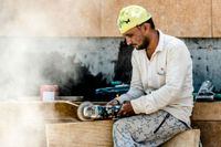 hard at work using machinery