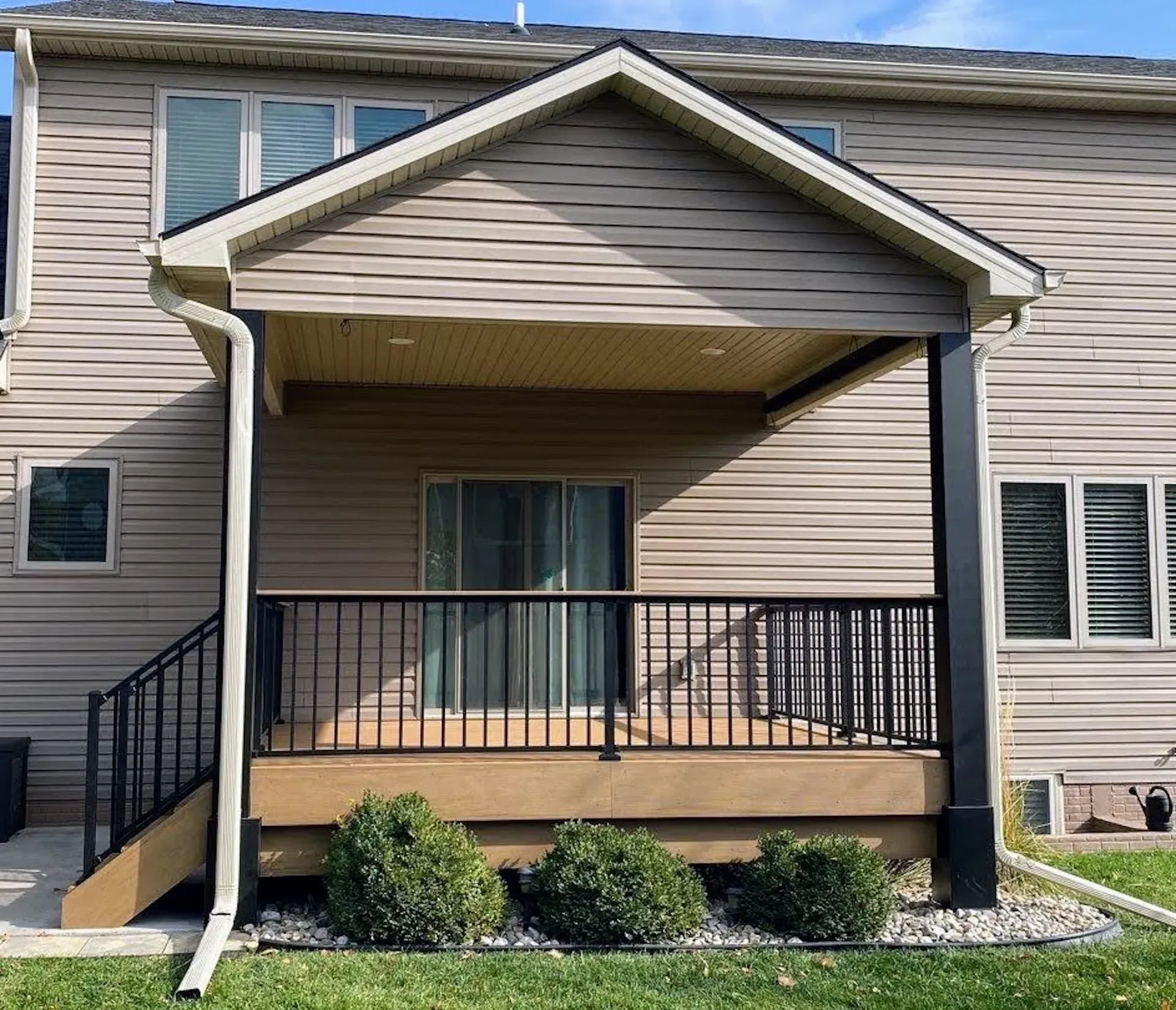 The front of a house with a porch and stairs