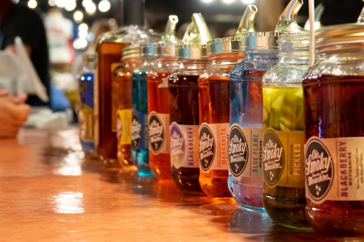 A row of colorful bottles labeled 
