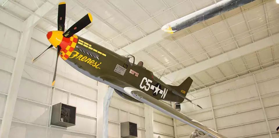 A vintage P-51 Mustang fighter plane, named 