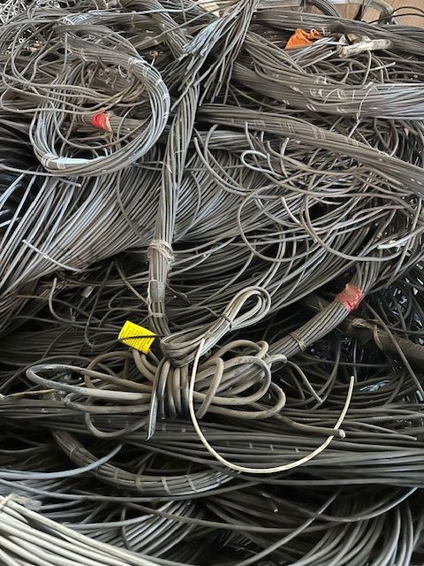A pile of wire with a yellow tag on it.