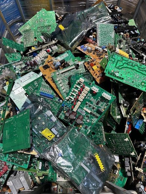 A pile of electronic components including a motherboard