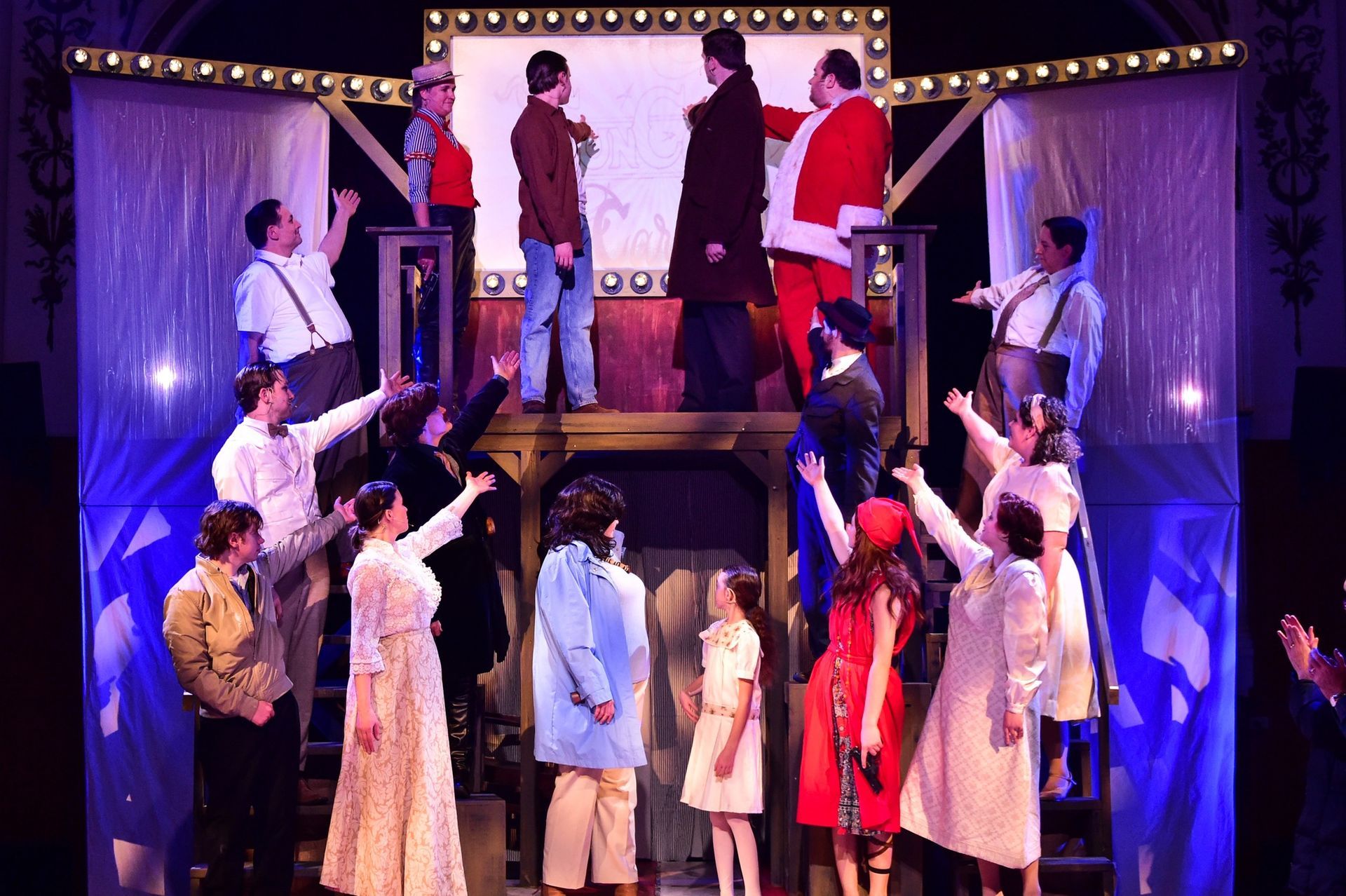 A group of people are standing on a stage in a play.