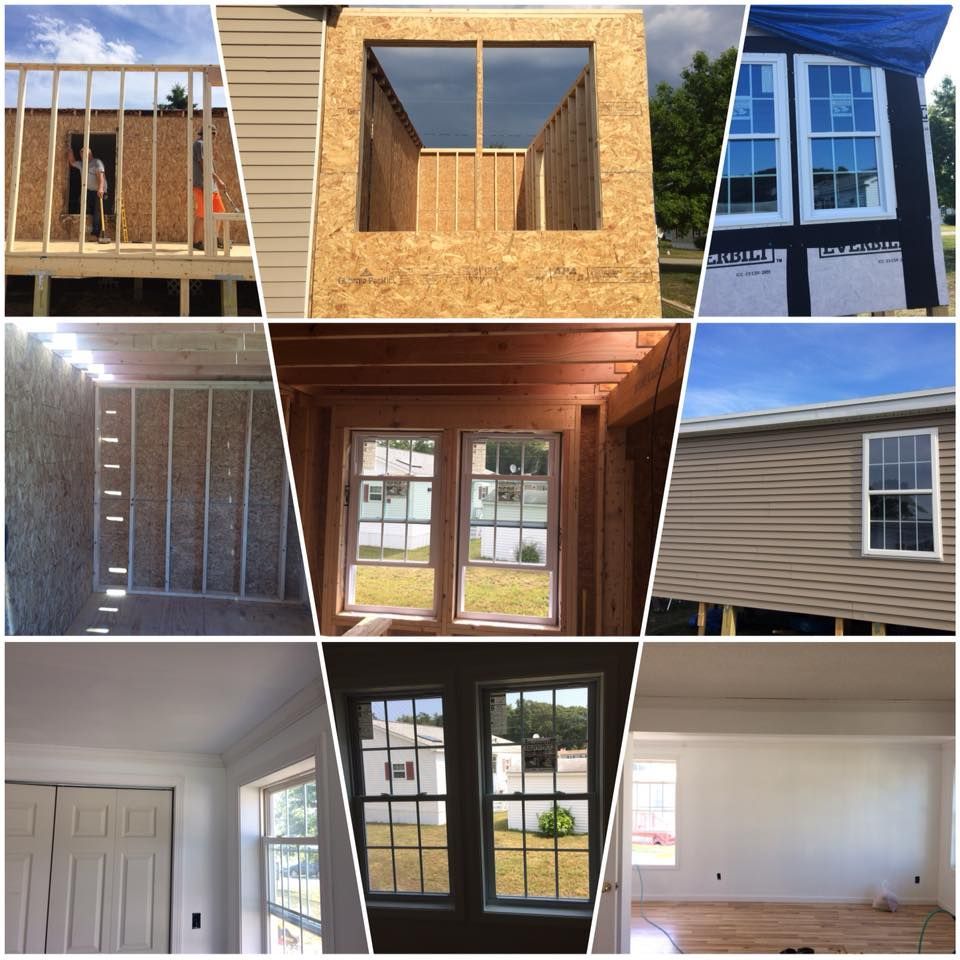 Men working on a roof, installing wooden panels. Blue sky with clouds.