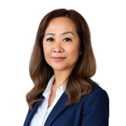 Asian woman in a navy blazer and white shirt smiles at the camera, headshot.