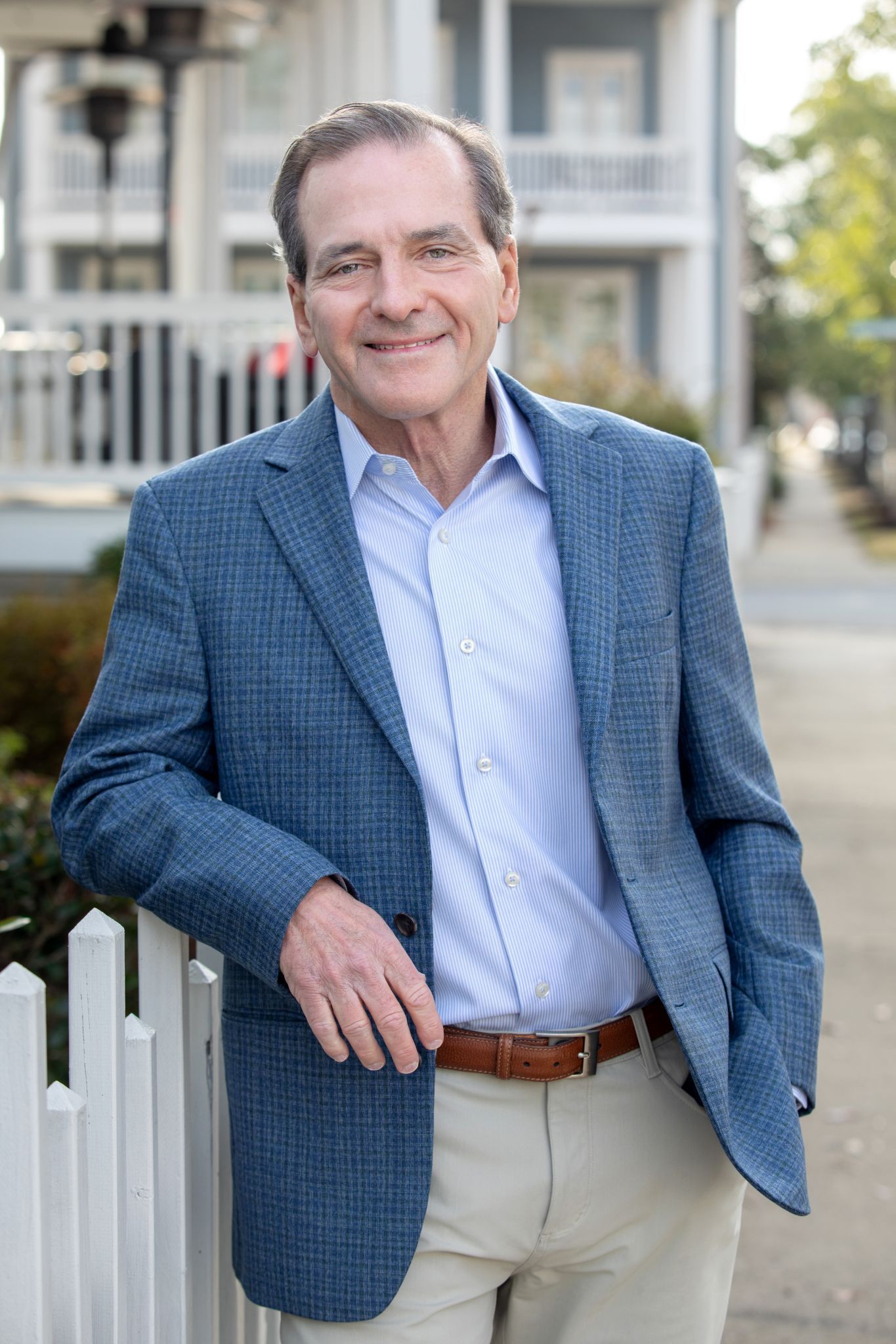 A silhouette of a person in a square on a white background.