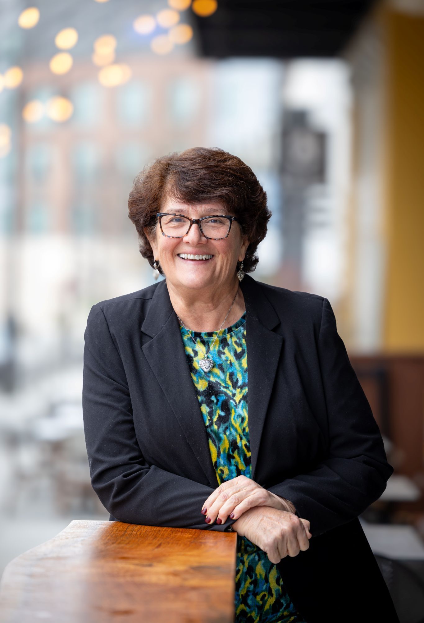 A silhouette of a person in a square on a white background.