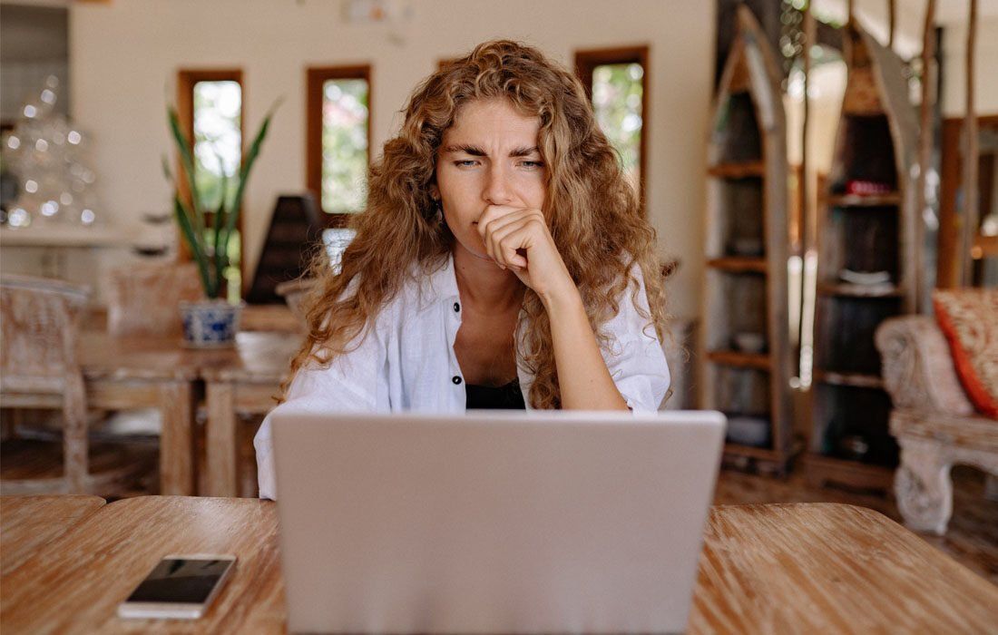 A Woman Reflection On Laptop — Financial Advisor in Kingscliff, NSW