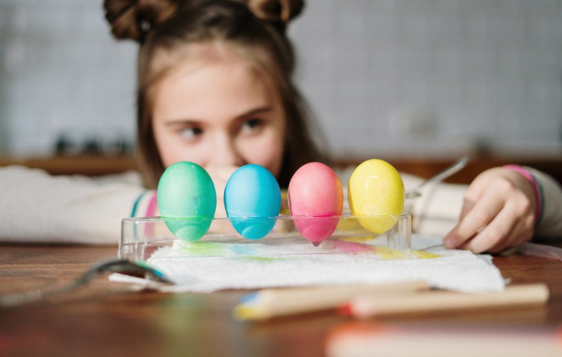 A Girl Looking Into 4 Eggs Colours — Financial Advisor in Kingscliff, NSW