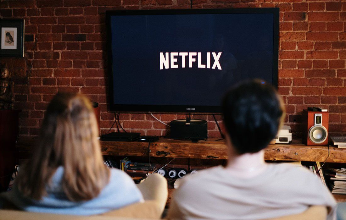 Couple Watching In Netflix — Financial Advisor in Kingscliff, NSW