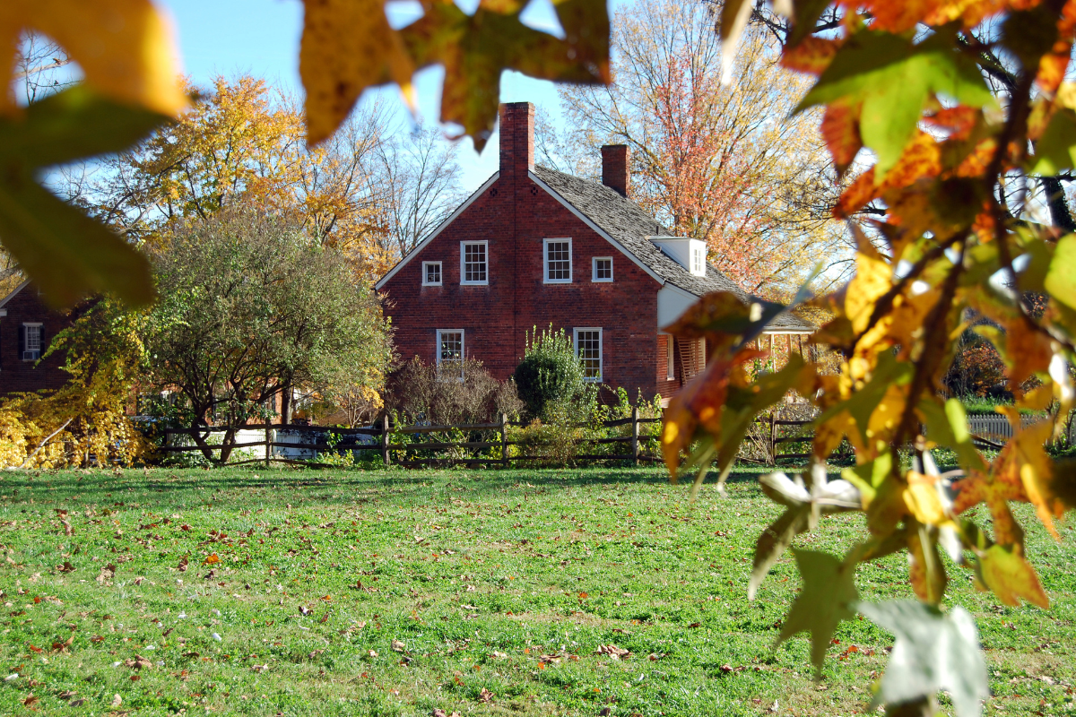 Autumn day on  a property with a red house