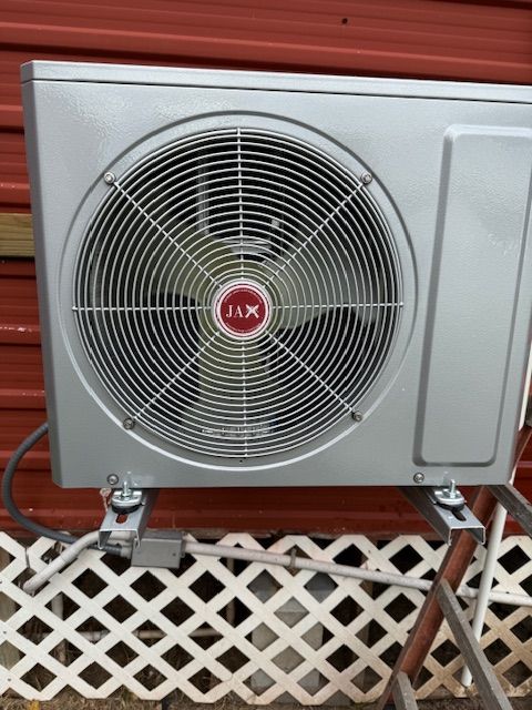 A silver fan with a red x on it