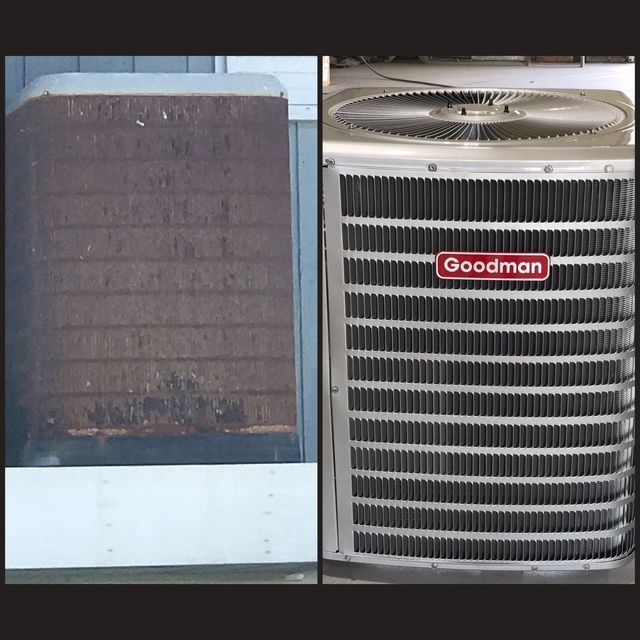 A goodman air conditioner is sitting next to a brick wall