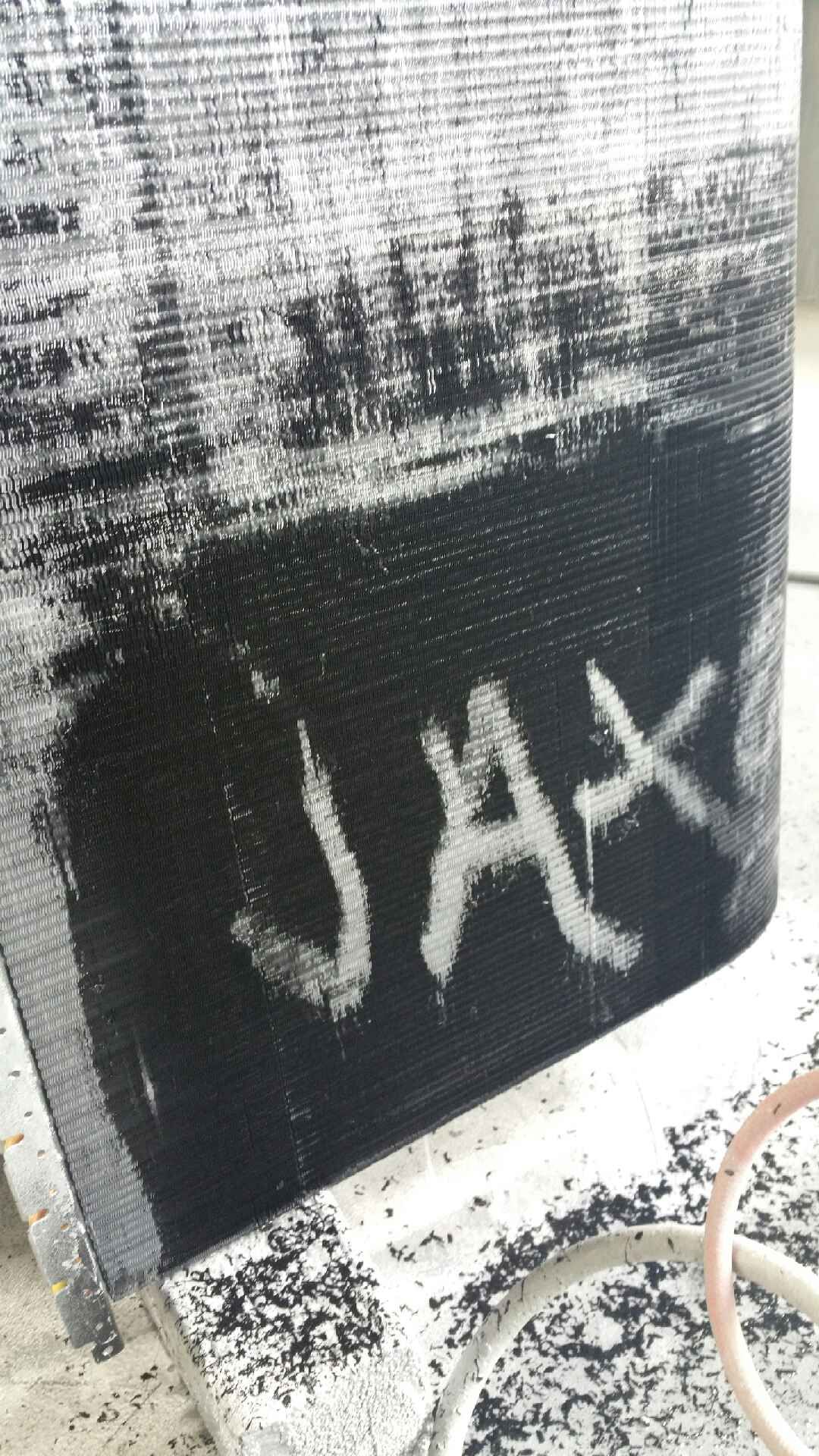 A black and white painting with the name jax written on it