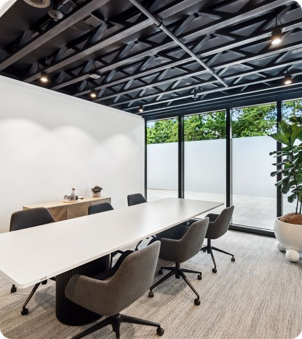 An office meeting room with glass windows  — Moltus Construction in Braddon, ACT