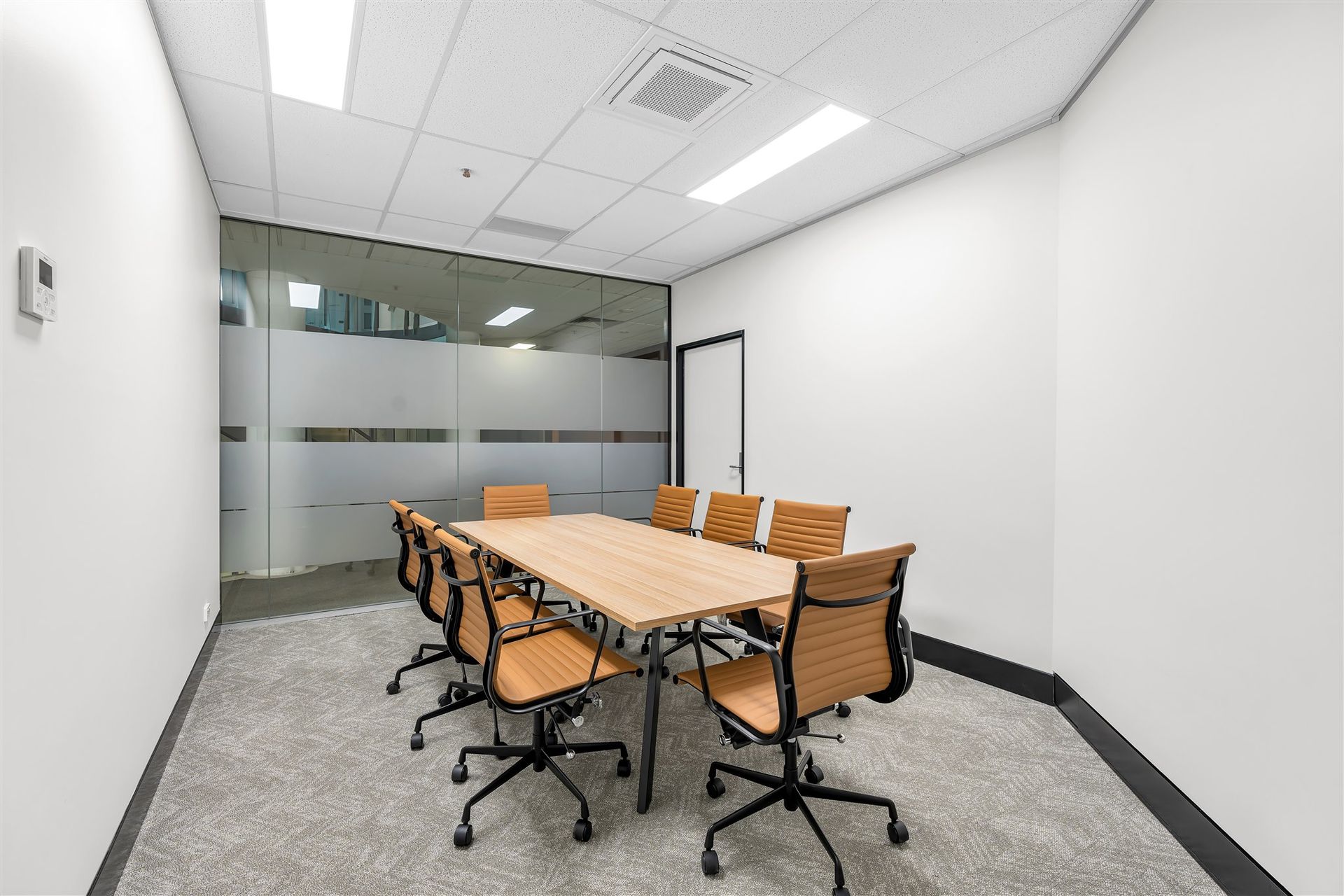 A Conference Room With a Long Table and Chairs — Moltus Construction in Braddon,  ACT