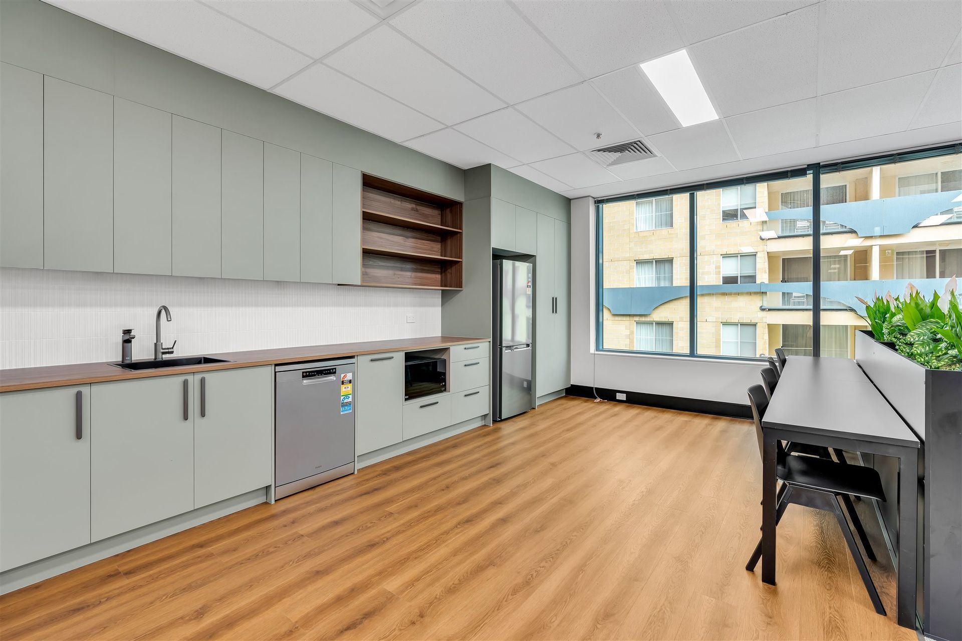 A Kitchen With a Sink, Dishwasher, and a Large Window — Moltus Construction in Braddon,  ACT