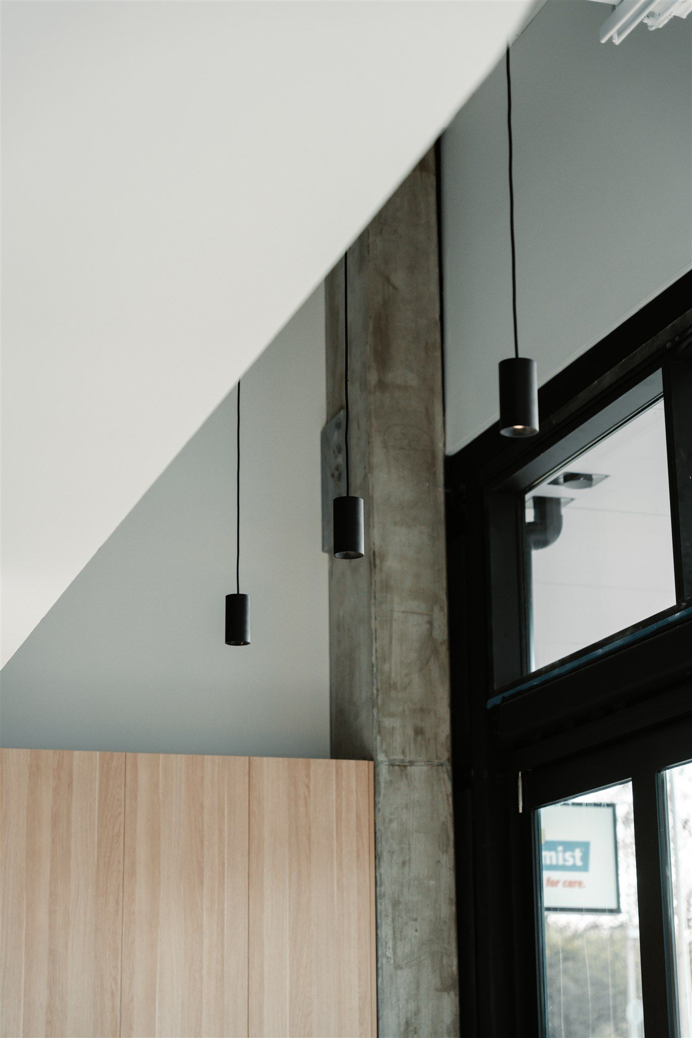 There Are a Lot of Lights Hanging From the Ceiling in This Room — Moltus Construction in Braddon,  ACT