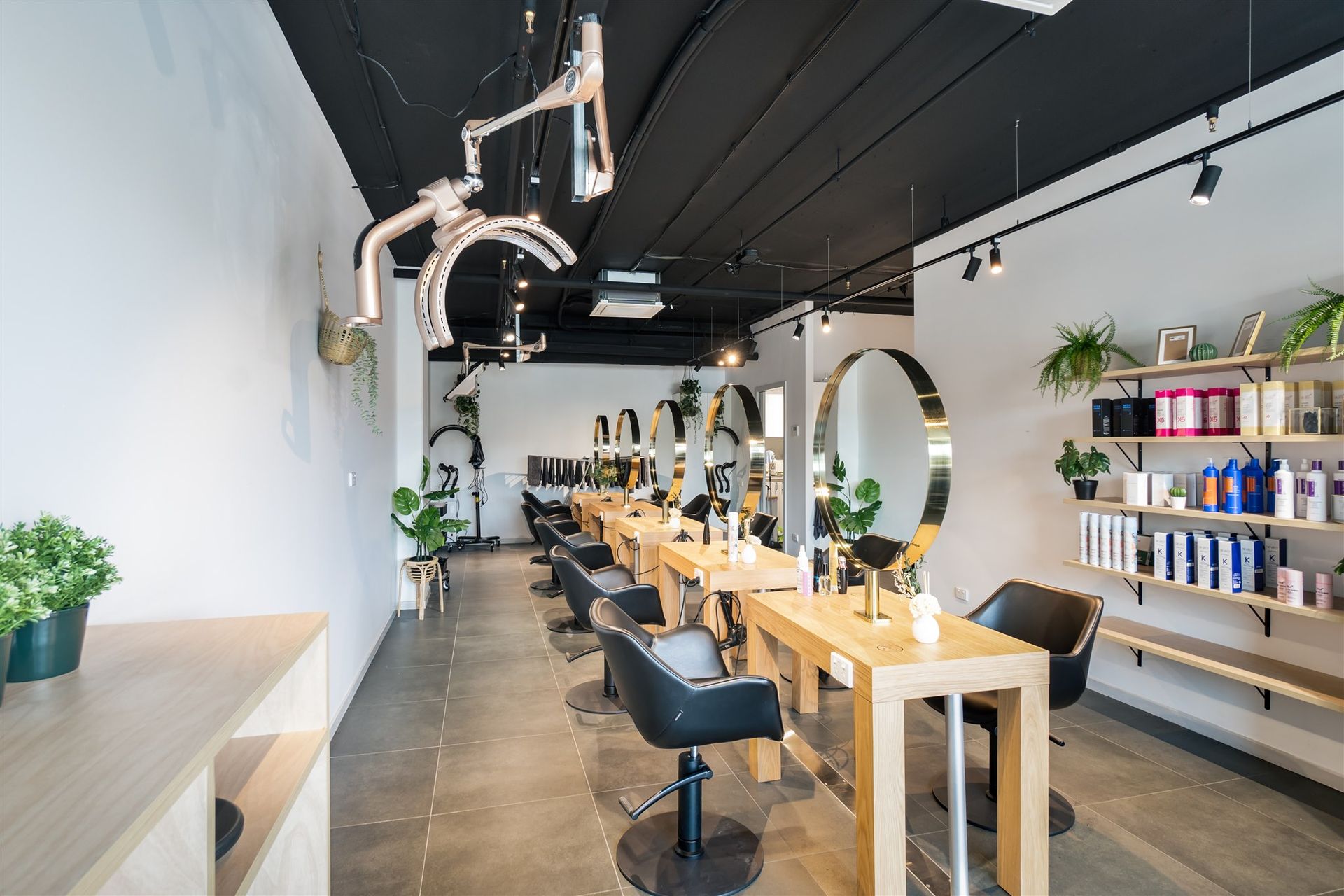 A Hair Salon With a Lot of Chairs and Tables — Moltus Construction in Braddon,  ACT