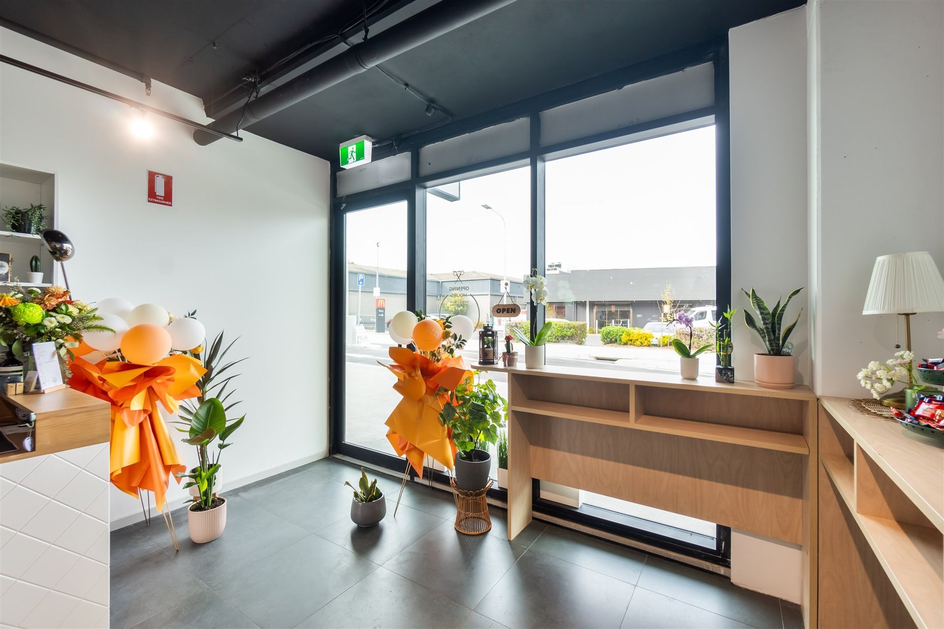 A Room With a Lot of Windows and Flowers on the Floor — Moltus Construction in Braddon,  ACT