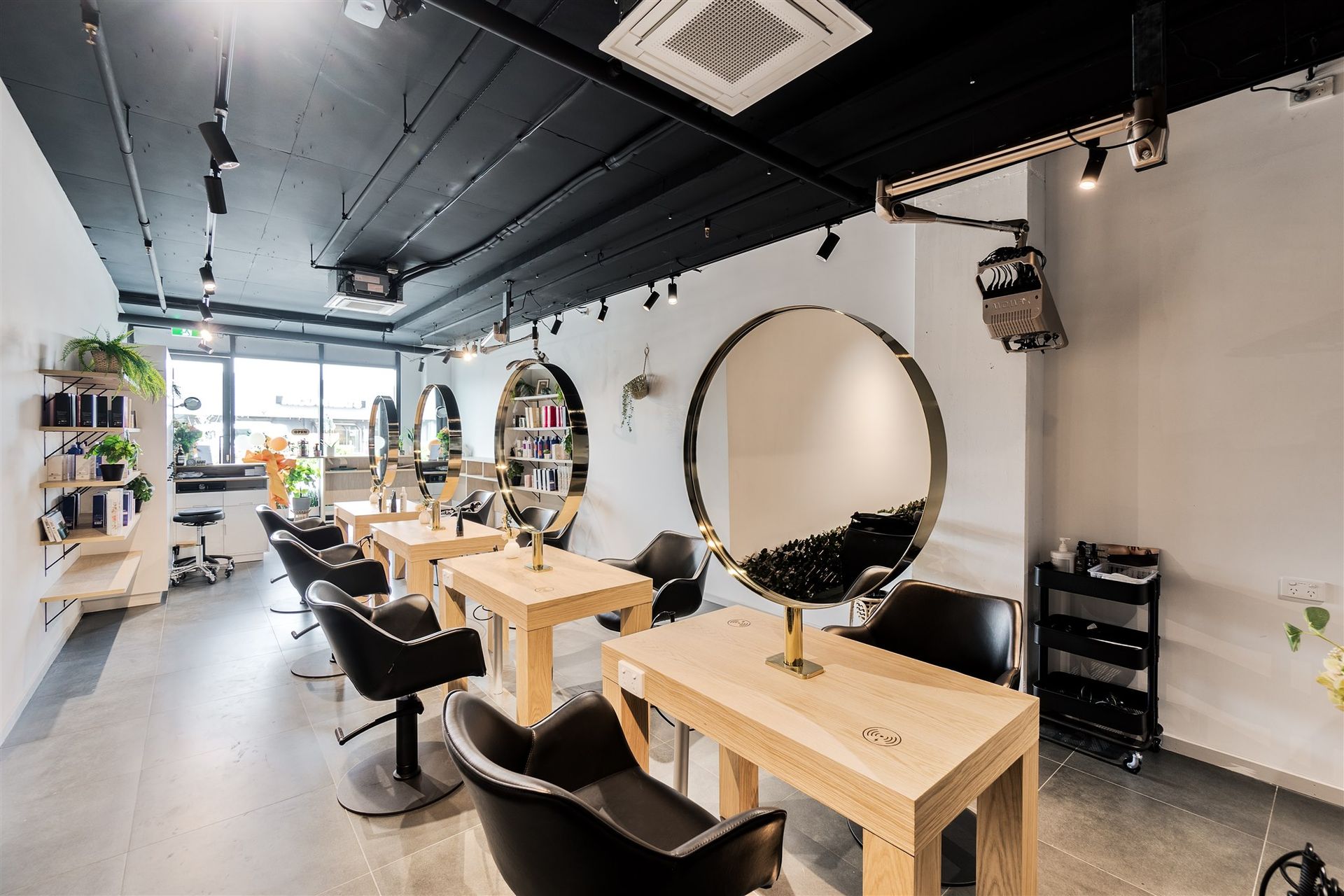 A Hair Salon With a Lot of Chairs and Tables — Moltus Construction in Braddon,  ACT
