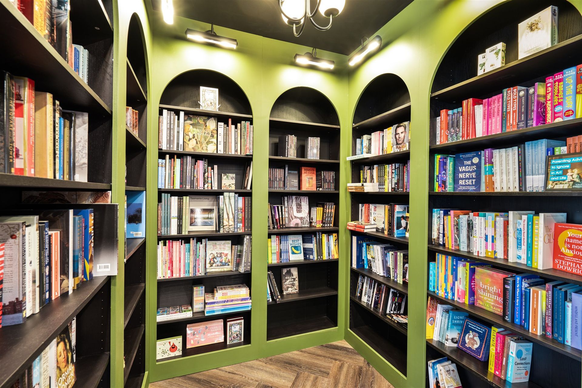 A Library Filled With Lots of Books on Shelves — Moltus Construction in Braddon, ACT