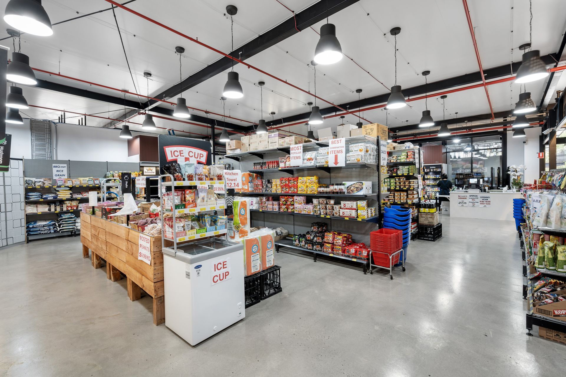 A Large Grocery Store Filled With Lots of Shelves and a Freezer — Moltus Construction in Braddon,  ACT
