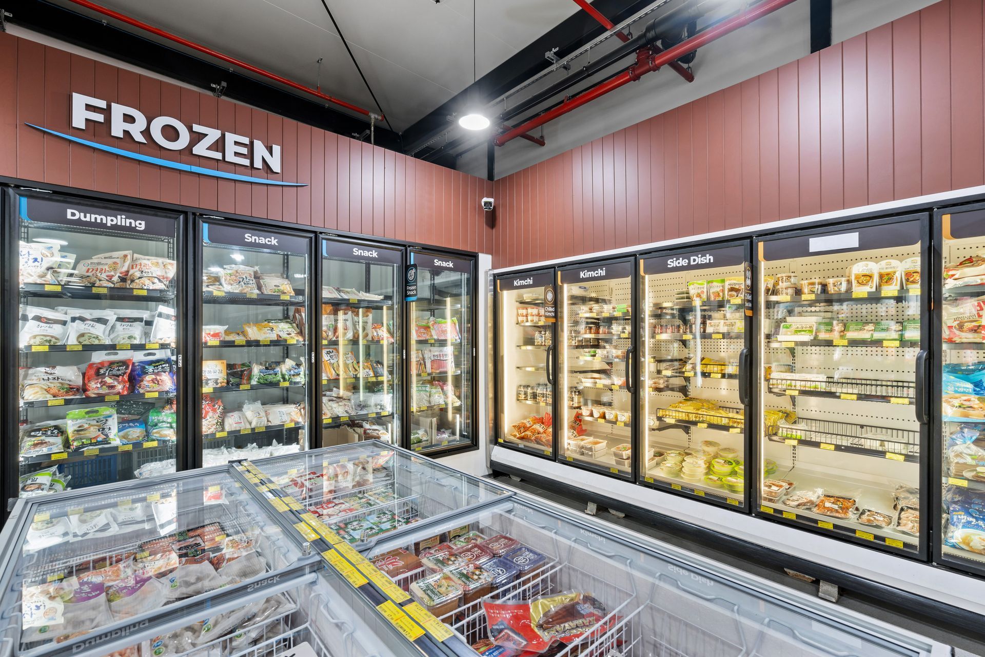 A Frozen Section of a Grocery Store Filled With Lots of Frozen Foods — Moltus Construction in Braddon,  ACT