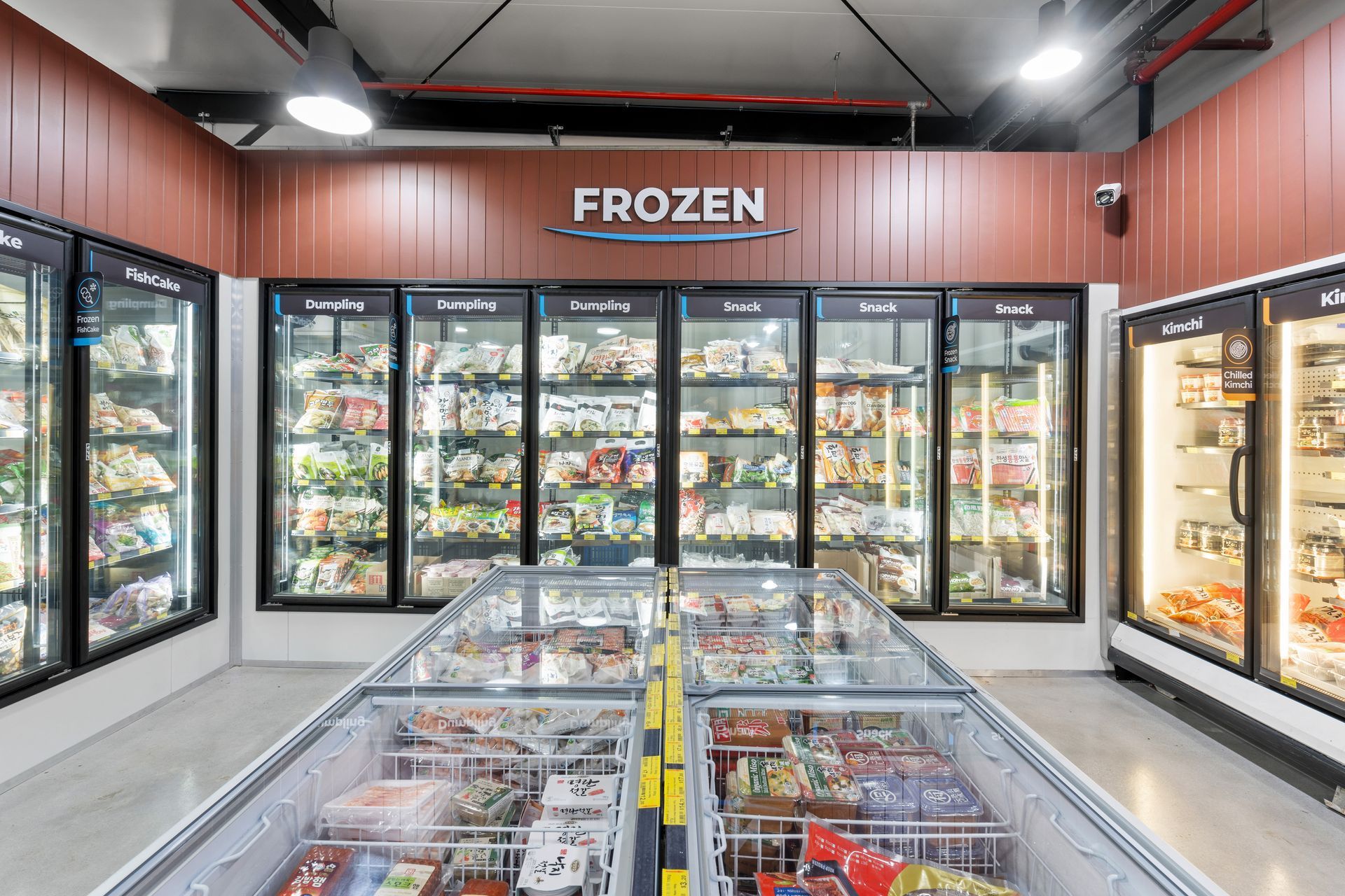 A Frozen Section of a Grocery Store Filled With Lots of Frozen Food — Moltus Construction in Braddon,  ACT