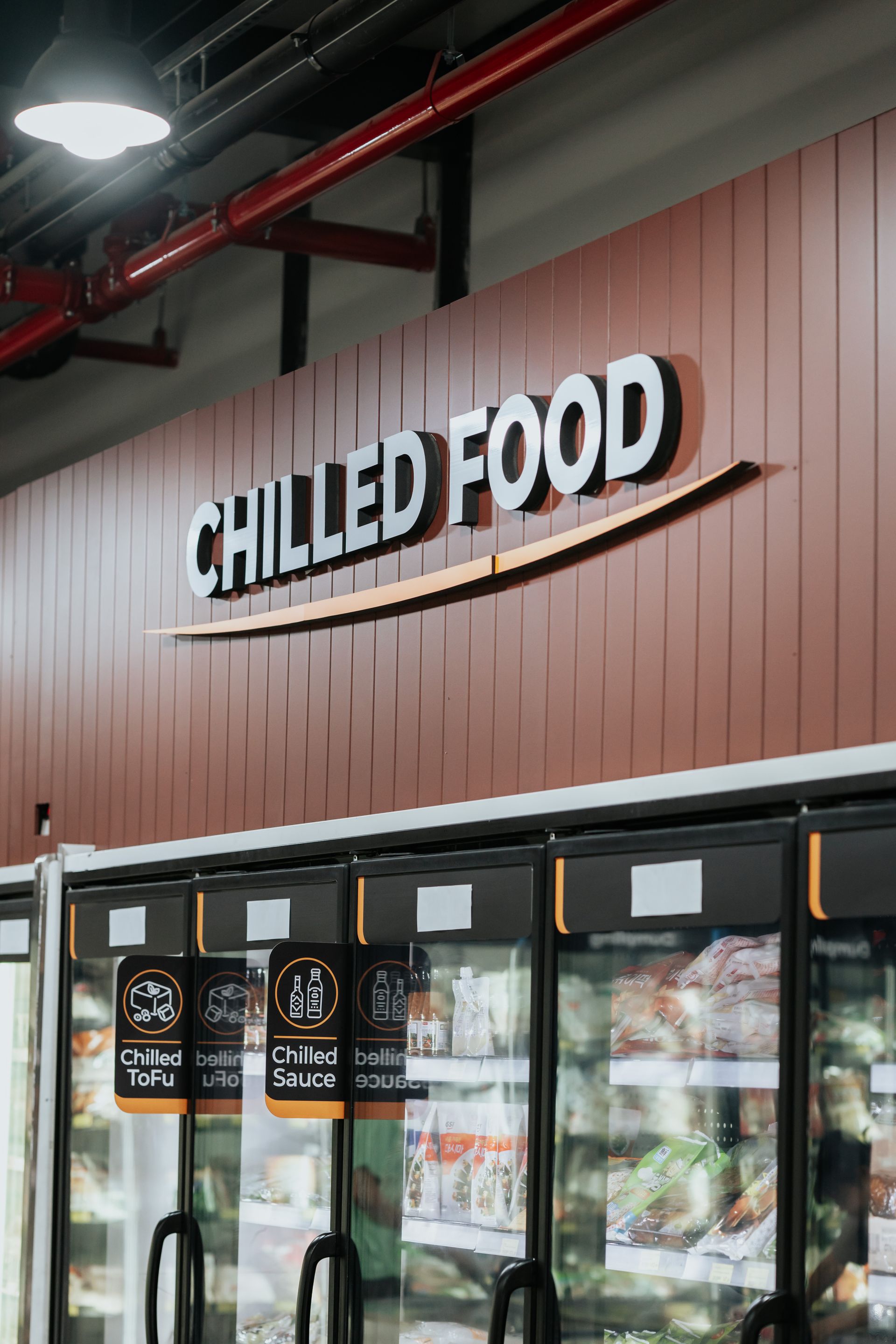 A Grocery Store With a Sign That Says Chilled Food — Moltus Construction in Braddon,  ACT