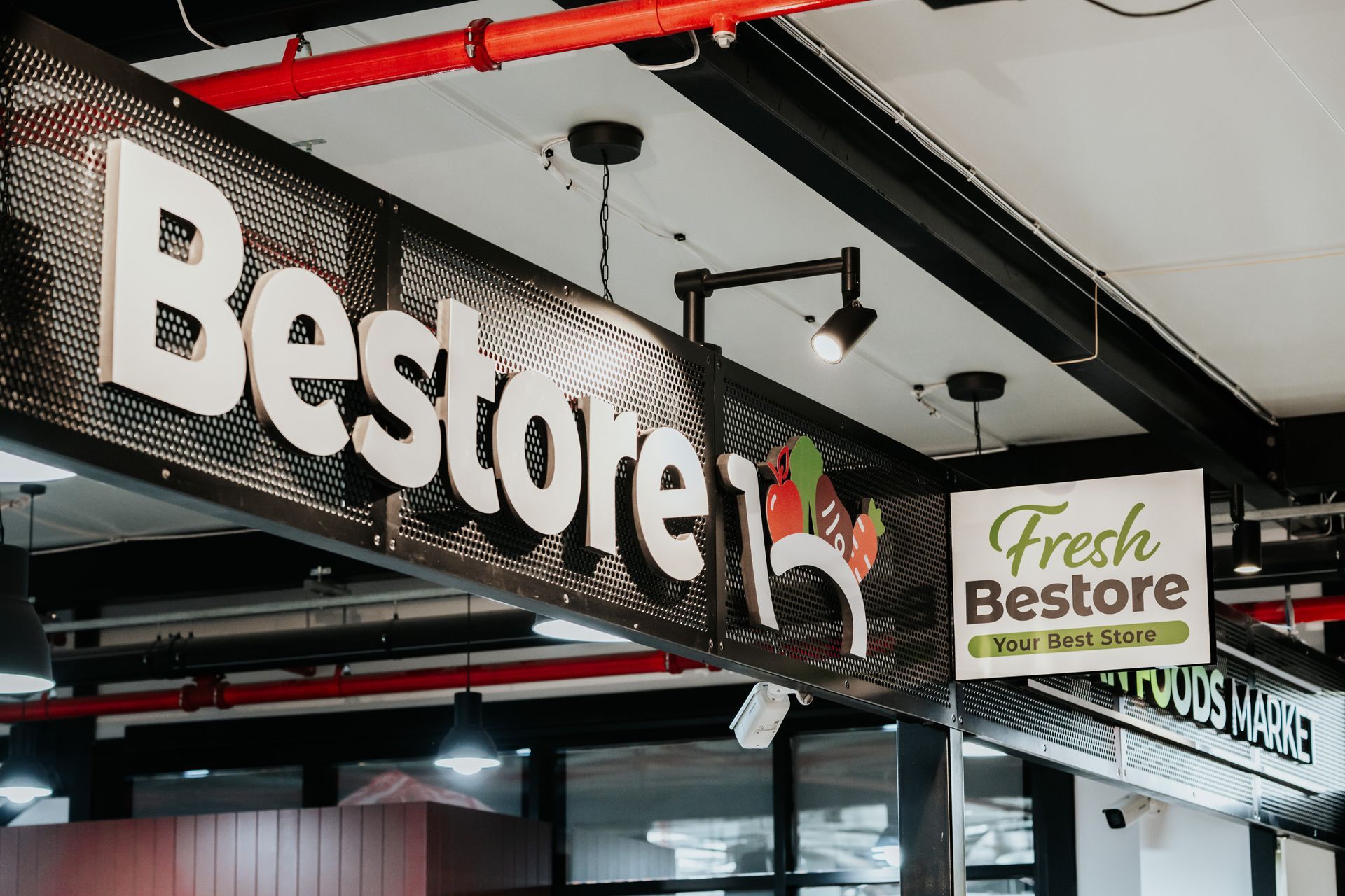 A Sign for Bestore Fresh is Hanging From the Ceiling of a Store — Moltus Construction in Braddon,  ACT