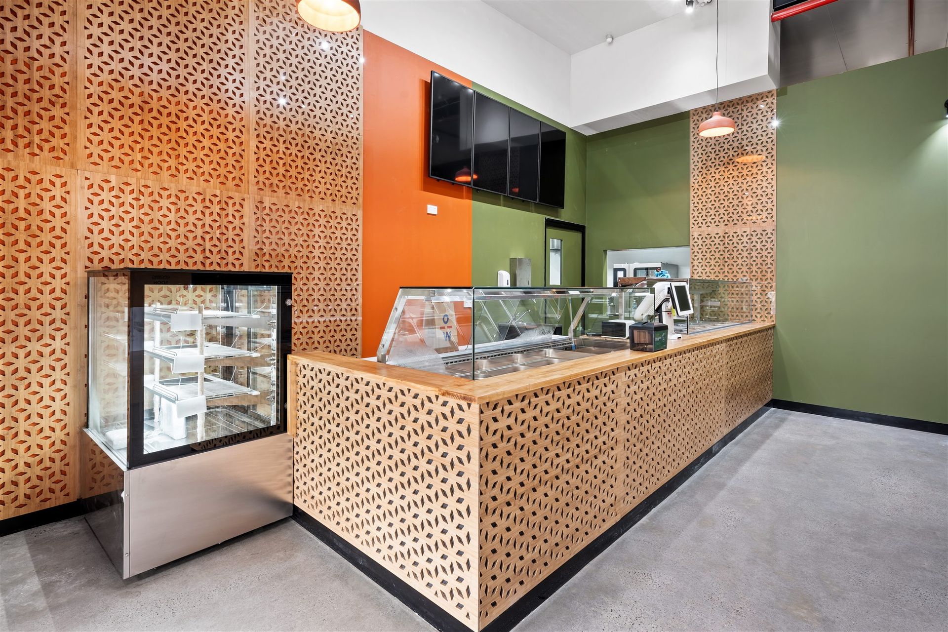 A Restaurant With a Counter and a Display Case — Moltus Construction in Braddon,  ACT