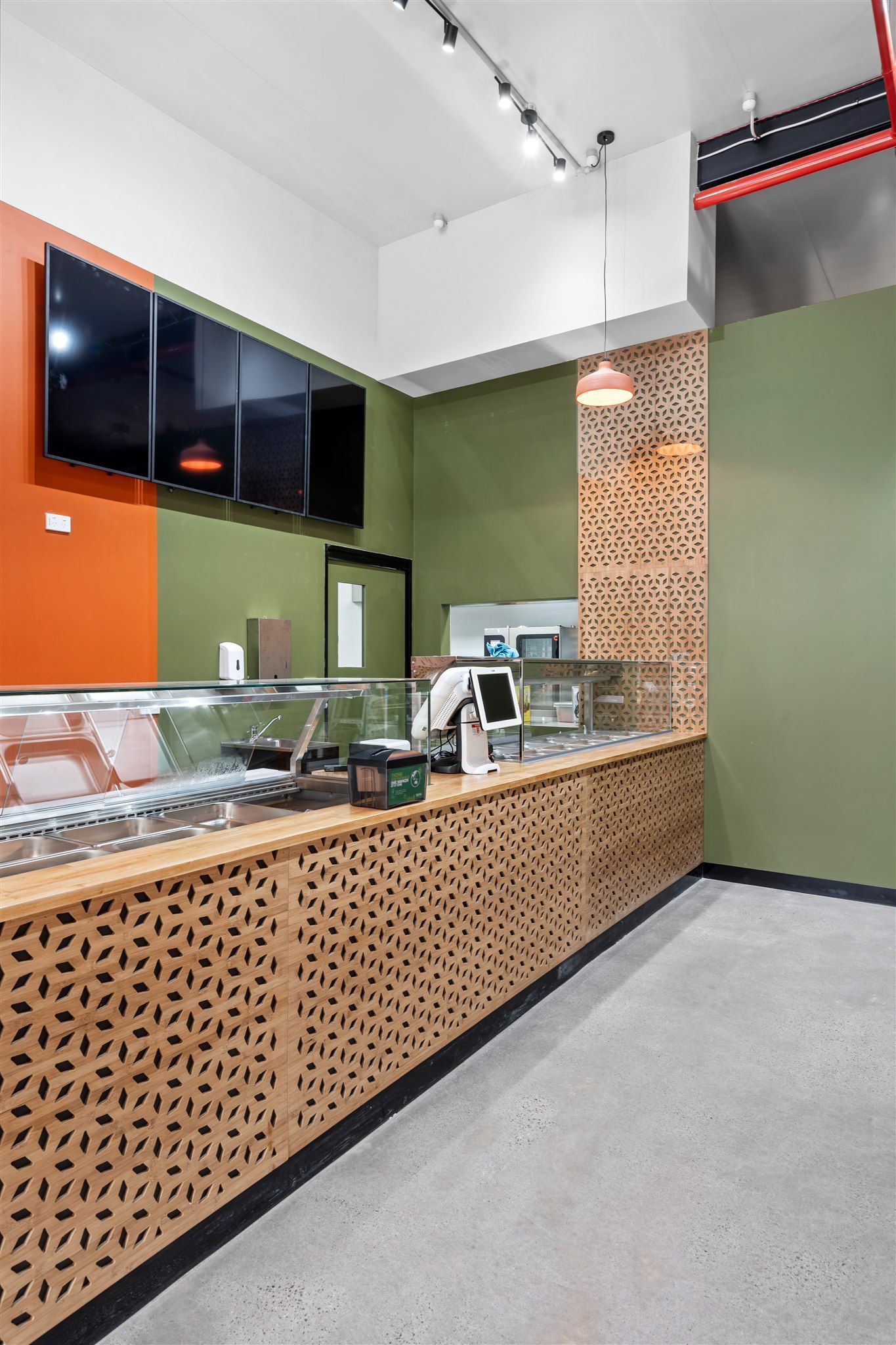 A Restaurant With a Counter and a Display Case — Moltus Construction in Braddon,  ACT