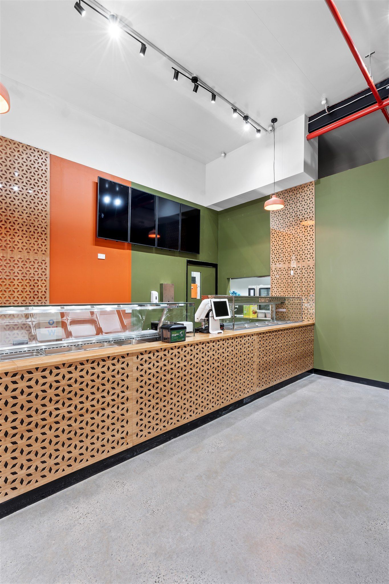 A Restaurant With a Counter and a Display Case — Moltus Construction in Braddon,  ACT