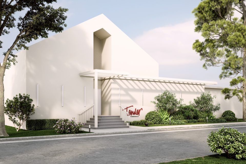 A White Building With the Word Tower Painted on It — Moltus Construction in Braddon, ACT