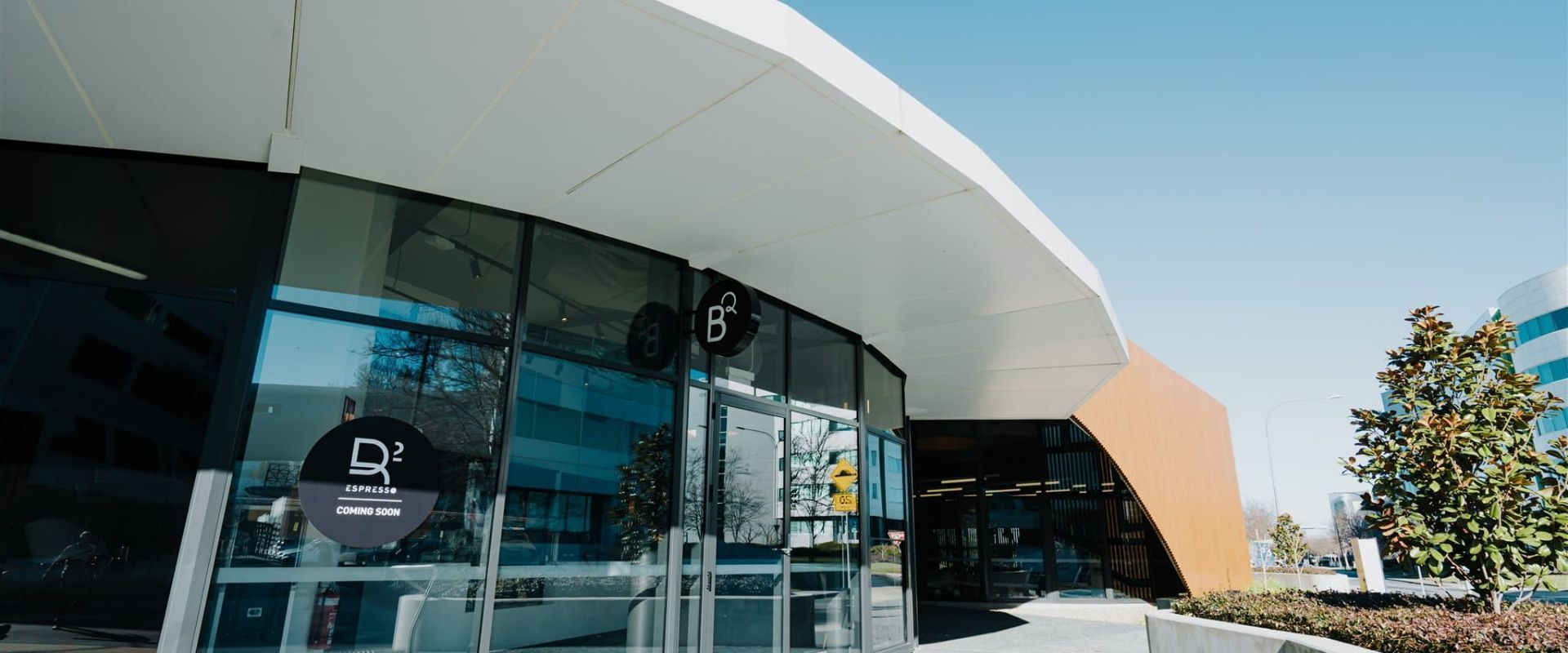 A building With A Blue Sky  In The Background  — Moltus Construction in Braddon, ACT