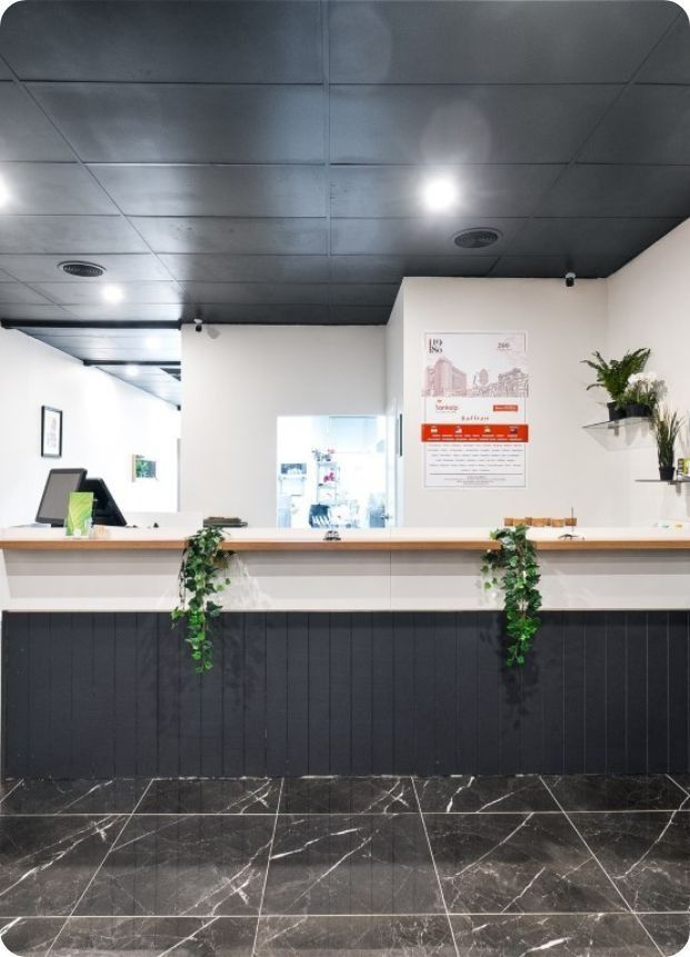 There is a Reception Desk in the Middle of the Room — Moltus Construction in Braddon,  ACT
