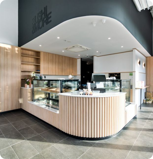 A Restaurant With a Sign That Says Sushi More — Moltus Construction in Braddon,  ACT