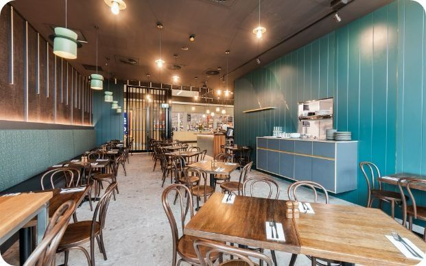 A Restaurant With Tables and Chairs and a Buffet — Moltus Construction in Braddon,  ACT