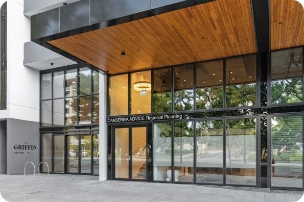 A Large Building With a Lot of Windows and a Wooden Ceiling — Moltus Construction in Braddon,  ACT