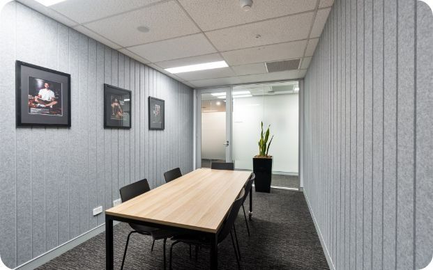 A Conference Room With a Long Table and Chairs — Moltus Construction in Braddon,  ACT