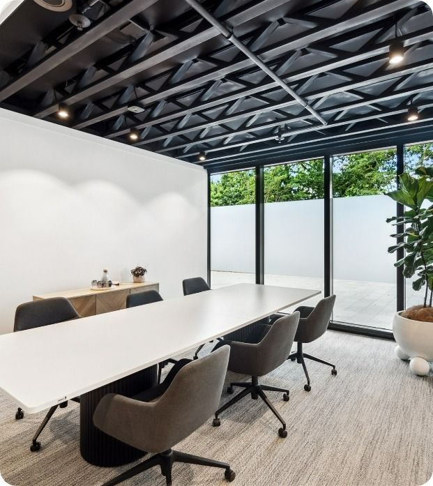 A Conference Room With a Long Table and Chairs — Moltus Construction in Braddon,  ACT