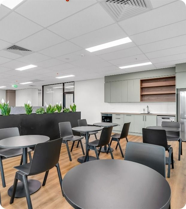 A Large Room With Tables And Chairs In It  — Moltus Construction in Braddon, ACT